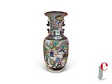 a vase that is sitting on a white surface