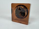 a brown clock with a black face on a white surface