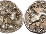 a silver coin with an image of a horse on it