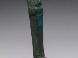 an egyptian bronze statue of a woman with a head on a wooden base