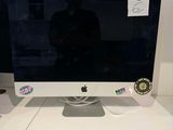a computer monitor sitting on top of a white desk