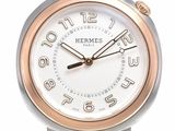 une montre-bracelet en argent et en or, avec un cadran blanc