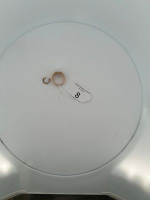 a white plate with a pair of scissors on it