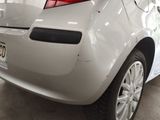 a white car that is parked in a garage