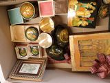a box filled with assorted items that include plates, bowls, and other items