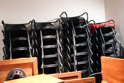 many chairs and tables in a room with a lot of them