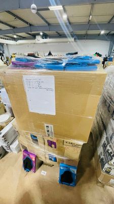 a large cardboard box sitting on top of a pile of boxes