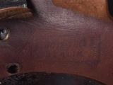 a close up view of a leather belt with a buckle