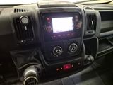 the dashboard of a truck with a digital display in the center of it