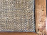a close up of a wooden table with a cloth on top of it