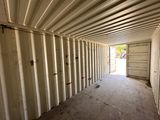 a large storage container in the middle of an empty room