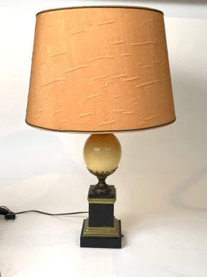a lamp that is sitting on a table with a lamp on it