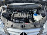 a car with its hood open and the engine in the trunk