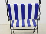 a blue and white striped chair sitting in a room