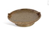 a brown bowl sitting on top of a white table