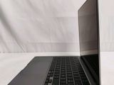 a laptop computer sitting on top of a white table
