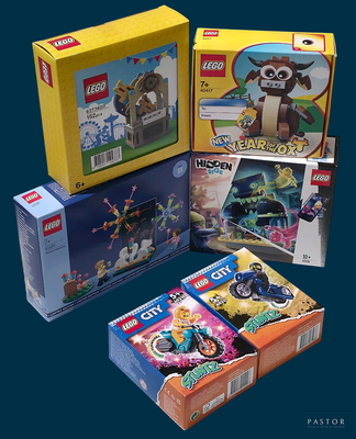three boxes of legos sitting next to each other on a table