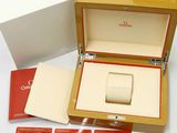 a box with a watch inside of it on a table
