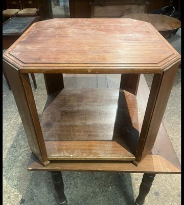 a small wooden table with a shelf on top of it