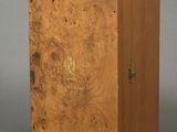 an image of a wooden box with a handle on a gray background