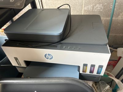 a printer that is sitting on top of a chair