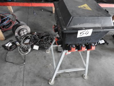 a black box sitting on top of a stand in a garage