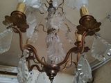 a chandelier that is hanging from the ceiling