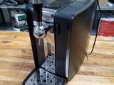 a coffee machine that is sitting on a wooden table