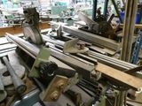 a machine that is working on a piece of wood