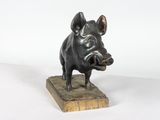 statue of a boar on a marble base on a white background