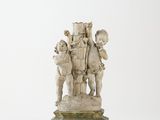 sculpture of a group of cherensils on a wooden base