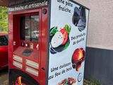a vending machine that has a lot of food on it