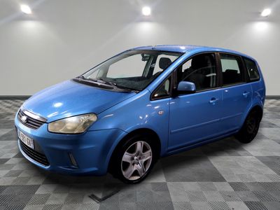 a picture of a blue car parked in a garage