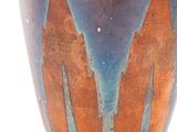a vase with a design on it on a white surface