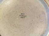 a close up of a plate with writing on it