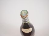 a bottle of beer that is sitting on a table