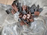 many pieces of metal that are sitting on a plastic bag