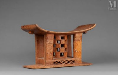 a wooden sculpture of a birdhouse with a bird on top of it