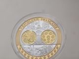 a close up of a coin in a clear box on a table