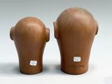 two vases that are sitting on a white surface