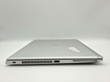 a close up of a laptop computer on a white surface