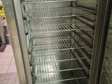 an image of a commercial refrigerator in a kitchen
