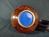 a picture of a decorative vase with a blue lid