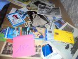 a pile of old photos and post it notes on the floor