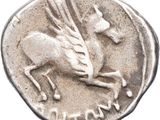 a close up of a silver coin with a horse on it
