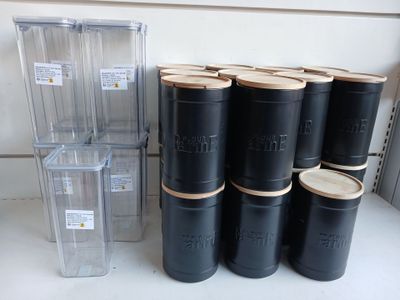 a stack of black barrels sitting on a counter