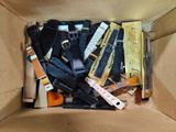 a cardboard box filled with different types of electronic devices