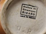 a close up of a vase with a label on it