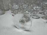 many empty wine glasses sitting on a table