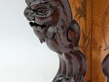 a close up of a wooden sculpture of a cat